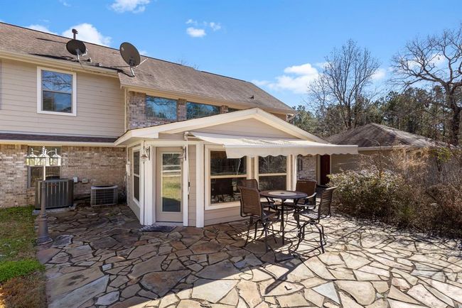 Back patio with retractable awning. | Image 36