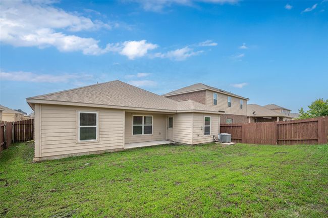 Back of house featuring roof with shingles and a patio | Image 25