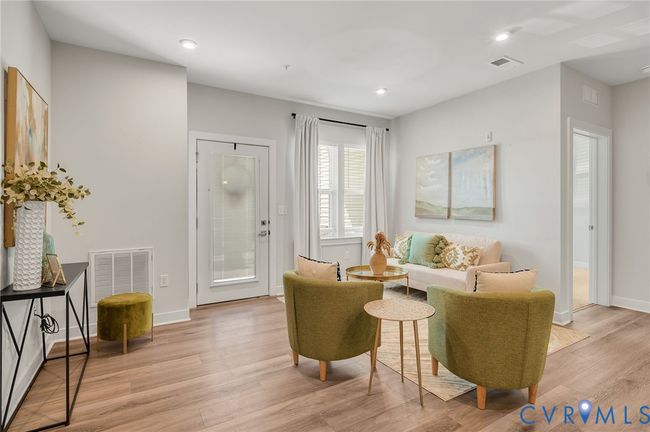 Living area featuring light wood finished floors and recessed lighting | Image 4