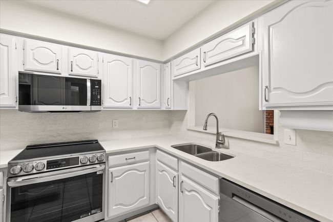 Freshly painted white cabinetry with full extension soft close drawers | Image 14