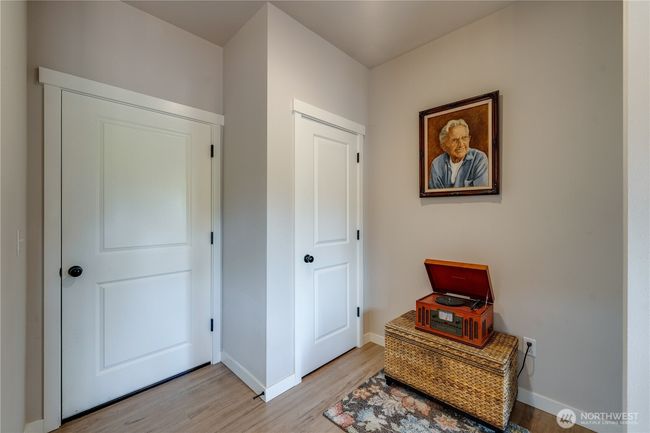 Cute entry way from the dining room, showing the garage and coat closet (or pantry/storage). Primary room is to the right. | Image 19