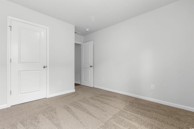 Unfurnished bedroom with carpet floors | Image 10