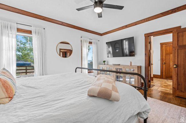 Bedroom featuring access to exterior, hardwood / wood-style floors, and ceiling fan | Image 20