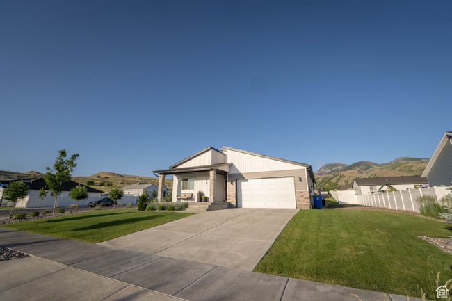 The front yard was professionally designed with modern, low-maintenance plants that seamlessly carry the home’s aesthetic from the inside out. Every detail was carefully planned and beautifully maintained. Plus, a full backyard landscape plan is include | Image 35