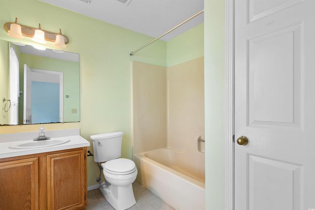 Full bathroom featuring vanity and bathtub / shower combination | Image 16