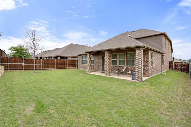 Back of property with Covered patio area, and spacious Yard | Image 34
