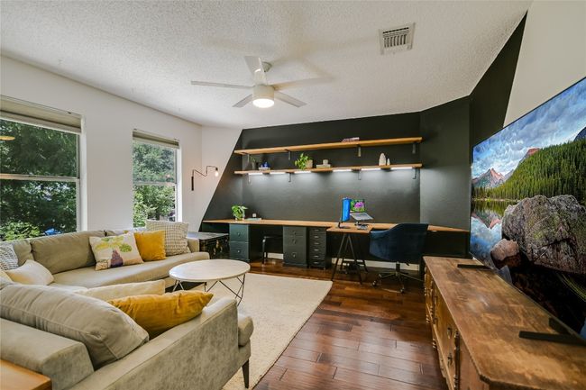 Upstairs bonus/living space perfect for a home office or media/game room. | Image 11