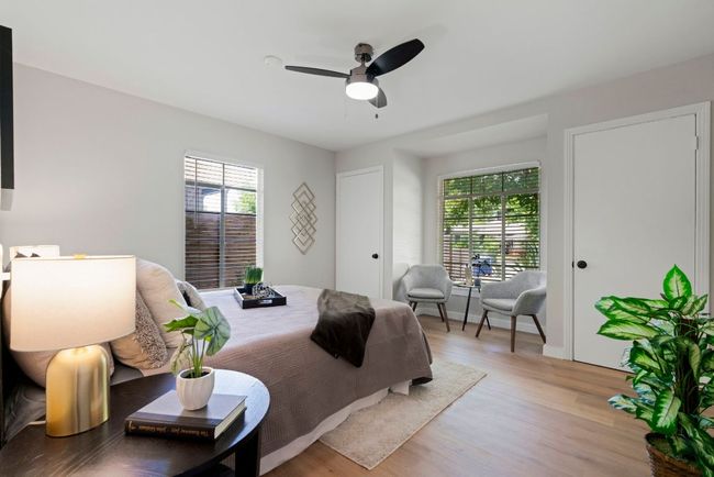 The primary bedroom is large and boasts a sitting area and his and her walk-in closets for all of your wardrobe and accessories. | Image 10