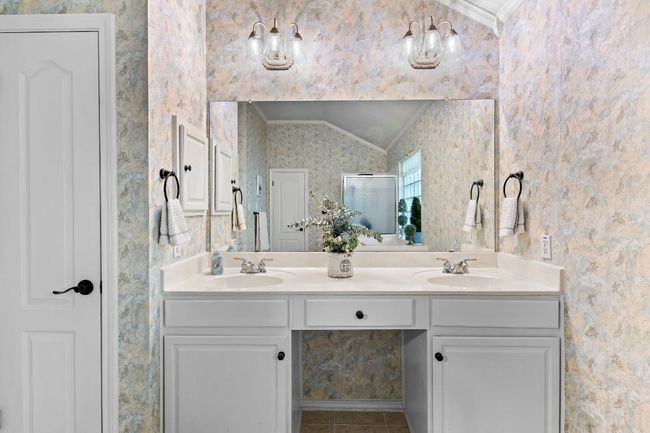 Bathroom with crown molding, vanity, and tile patterned floors | Image 26