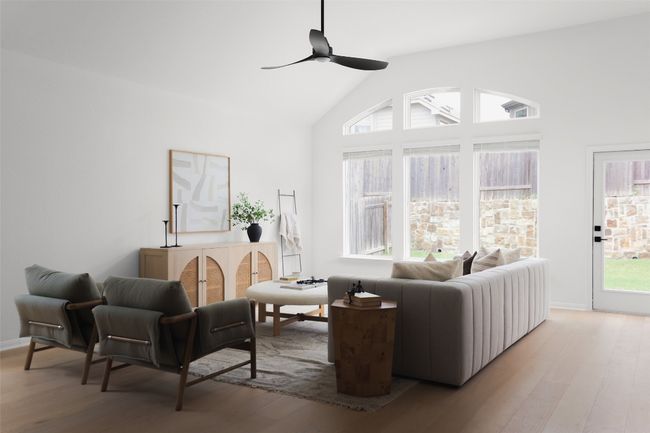 High ceilings and fan add comfort and style to living area. | Image 7