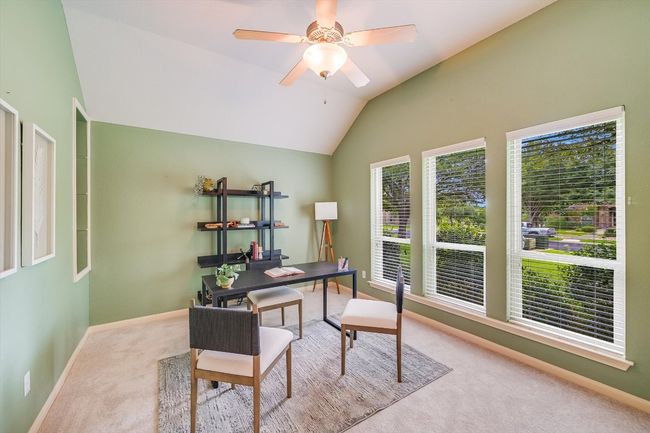 Carpeted office with ceiling fan and vaulted ceiling | Image 11