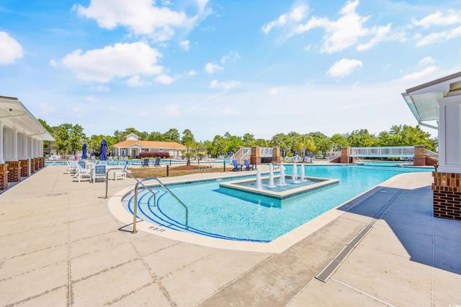 Community pool featuring a patio area | Image 11