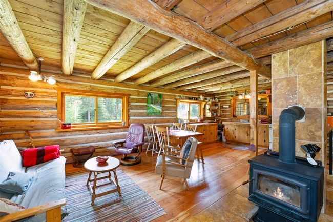 Open space and cozy wood burning stove. | Image 12