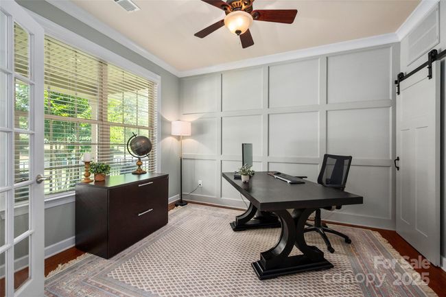 Home office with custom accent wall with storage closet | Image 6
