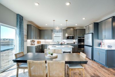 This layout provides ample seating and countertop space. *Photos used are of a model home. | Image 3