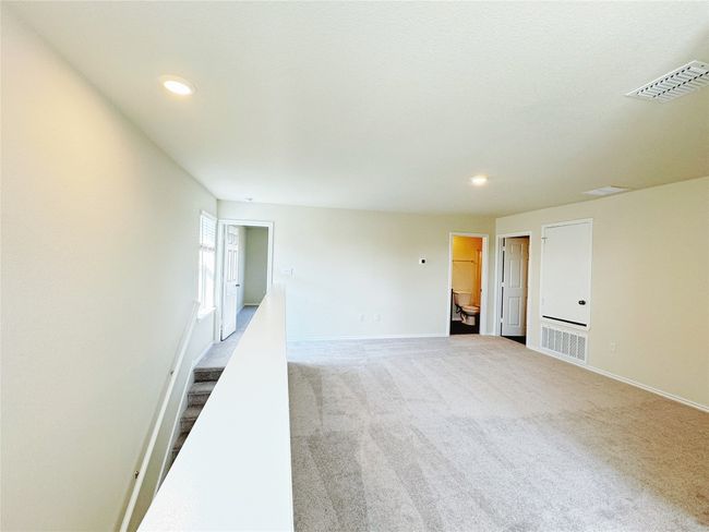 Unfurnished room featuring carpet flooring, recessed lighting, baseboards, and stairs | Image 21