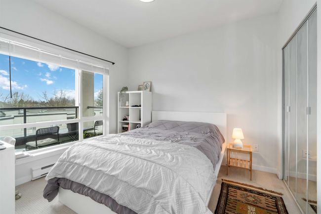Carpeted bedroom featuring baseboards, a baseboard heating unit, and a closet | Image 19