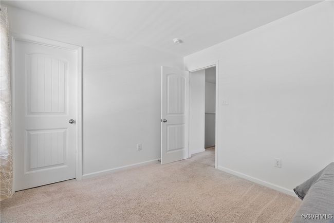 Unfurnished bedroom with carpet floors and baseboards | Image 22