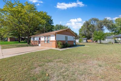 View of property exterior featuring a lawn | Image 3