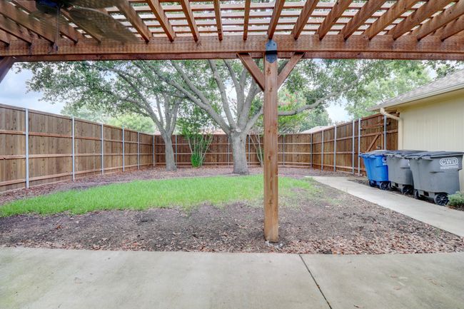 Fenced backyard featuring a pergola | Image 26