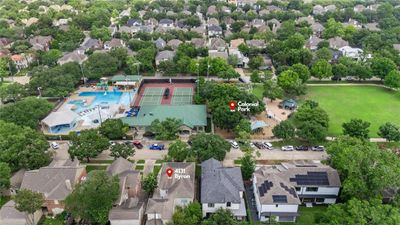 This stunning two-story home sits directly across from the majestic Colonial Park and Pool, offering an idyllic view and convenient access to outdoor recreation. | Image 2