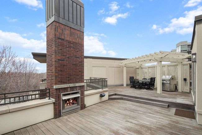 Private rooftop deck with gas fireplace & connected to the home sound system | Image 50