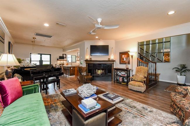 Large main living room, features a gas fireplace. Living room and dining room are open to eachother, offering an open floor plan. | Image 9