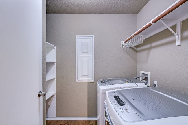Washroom with independent washer and dryer and wood finished floors | Image 9