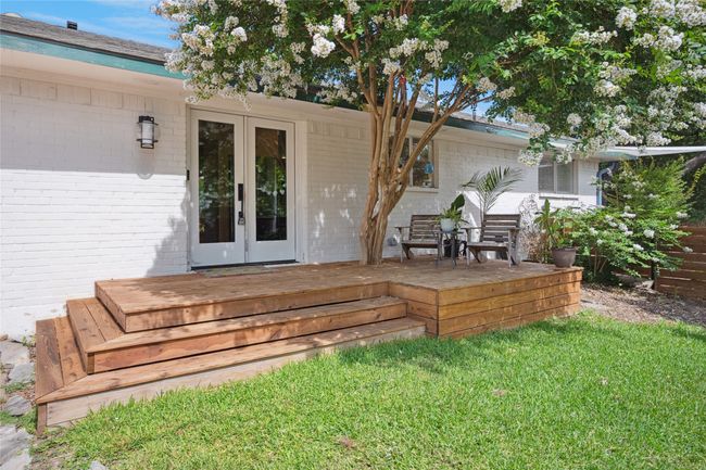 Side shaded patio with direct access to kitchen - great for early morning coffee retreat! | Image 21