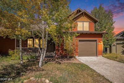 View of front facade with a garage | Image 2