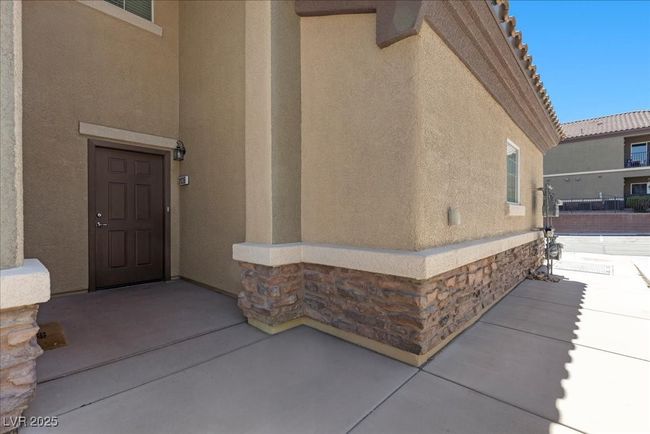Property entrance with stucco siding and stone siding | Image 4