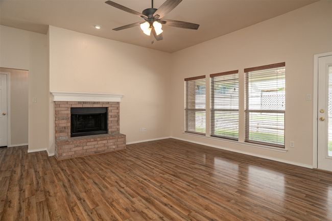 Living room with fireplace | Image 10