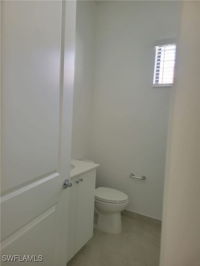 Half bathroom with toilet and vanity | Image 21
