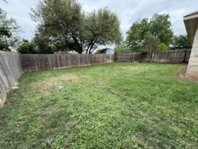 View of yard featuring a fenced backyard | Image 10