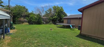 View of yard featuring a trampoline | Image 3