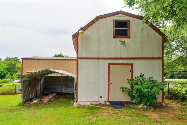 View of outdoor structure with a carport | Image 40
