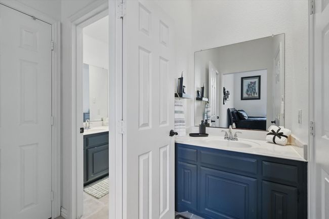 Dedicated vanity for 3rd bedroom. Entrance to jack-n-jill bath to the left. | Image 26