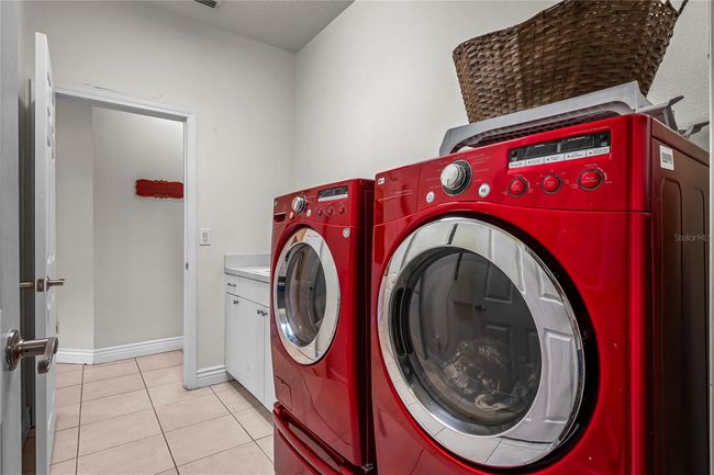 Inside Laundry Room off Garage and across hall is kitchen | Image 13