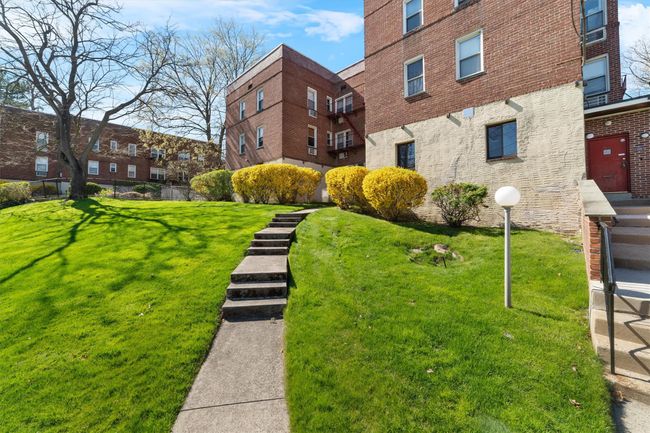 View of home's community featuring a lawn | Image 6