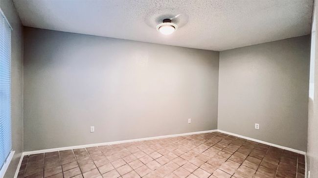 Spare room with a textured ceiling | Image 5