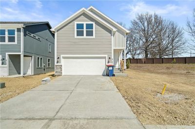 Front of property featuring a garage | Image 1