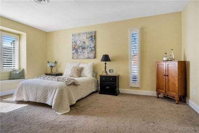 Carpeted bedroom with baseboards | Image 21