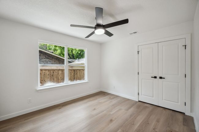 Unfurnished bedroom with light wood-type flooring, a closet, baseboards, and ceiling fan | Image 24
