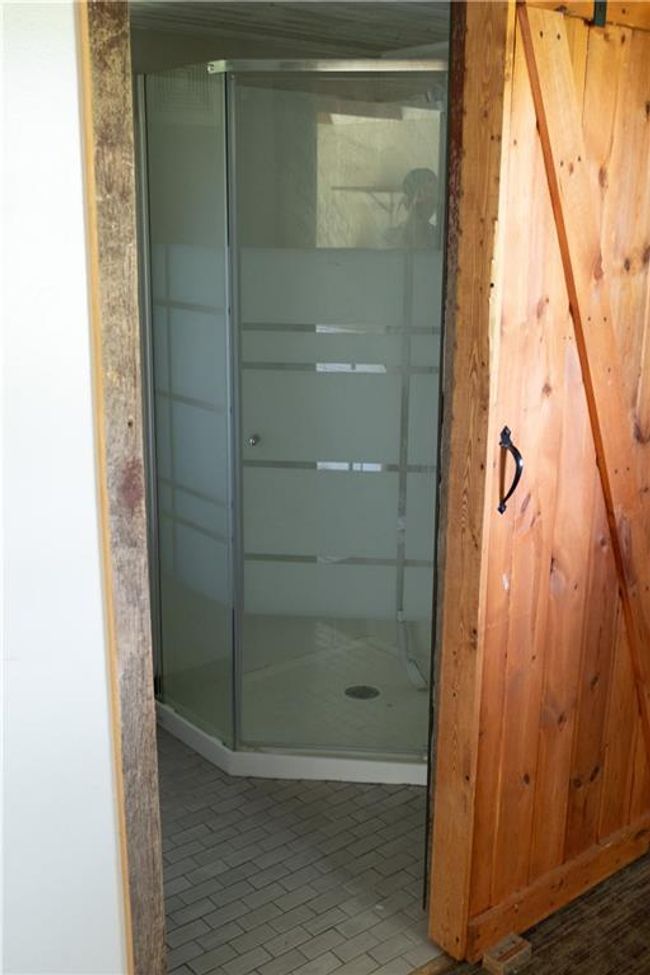 Bathroom featuring a shower stall | Image 5