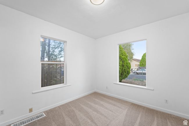 Empty room featuring baseboards, carpet floors, and visible vents | Image 19