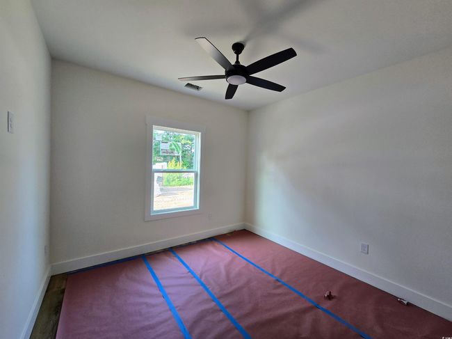 Unfurnished room with a ceiling fan and baseboards | Image 26