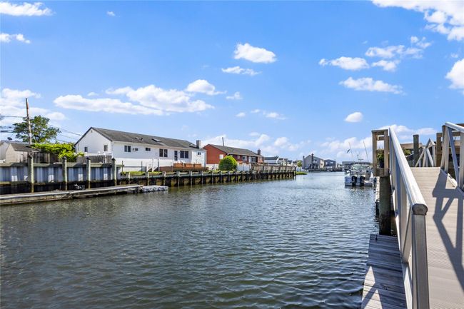 Dock area featuring a residential view and a water view | Image 5