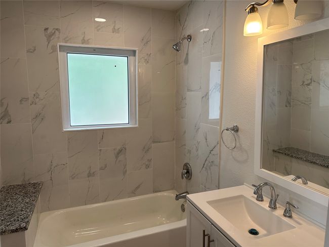 Bathroom with bathing tub / shower combination and vanity | Image 8