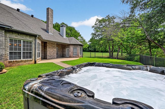 View of yard with a hot tub and a patio | Image 33