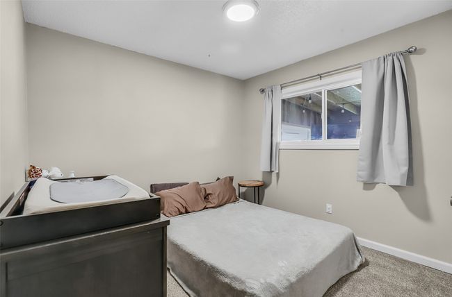 Carpeted bedroom with baseboards | Image 21